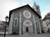 Barcelonnette - Saint-Pierre church and its squar bell tower, lamppost and houses of the city