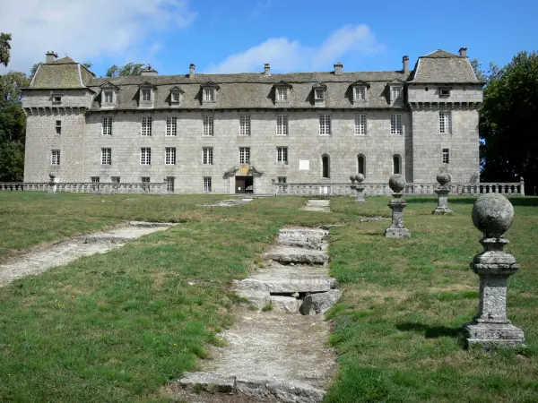La Baume castle - Park and facade of the castle; in the town of Prinsuéjols