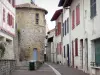 Bayonne - Plachotte Romanesque tower, facades of houses and narrow street of the old Bayonne