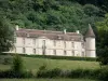 Bazoches castle - Former residence of Marshal Vauban: facade of the feudal castle surrounded by greenery; in the Morvan Regional Nature Park