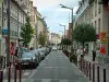 Beauvais - Rue, arbres, immeubles et magasins