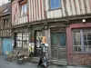 Bernay - Facades of half-timbered houses and front of a library