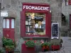 Besse-et-Saint-Anastaise - Medieval and Renaissance town: stone house home to a cheese shop and flower pots decorating the facade