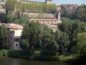 Béziers - Former bishop's palace (the Palais de Justice (law courts)), Saint-Jude church, houses of the city, trees along the water and the Orb river