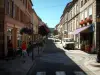 Bitche - Street in the city with café terrace, shops and houses