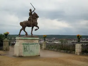 Blois - Terrace of the Bishop's palace gardens with a statue of Joan of Arc, cloudy sky