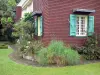 Botanischer Garten der Réunion - Kreolisches Haus und seine blühenden Sträucher