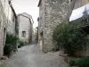 Boussagues - Sloping narrow paved street lined with stone houses