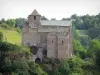 Bredons church - Roman fortified church, vestige of a Benedictine priory, perched on its basaltic rock, in the Regional Natural Park of the Volcanoes of Auvergne, in the town of Albepierre-Bredons