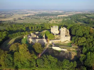 Butte de Thil - Butte de Thil and its medieval fortress surrounded by trees seen from the sky