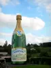 Champagne vineyards - Champagne vineyards: huge bottle of champagne, in Cramant (village of Côte des Blancs)