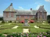 Château de Carrouges - Flowerbed in the garden and facade of the château; in the Normandie-Maine Regional Nature Park