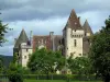 Château des Milandes - Château, arbres et ciel orageux, dans la vallée de la Dordogne, en Périgord