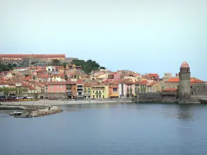 Collioure - Vermilion coast: view of the steeple of the Notre-Dame-des-Anges church and colorful facades of the old town on the Mediterranean sea