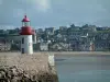 Erquy - Lighthouse, the Channel (sea) and sandy beach, houses on a hill in background