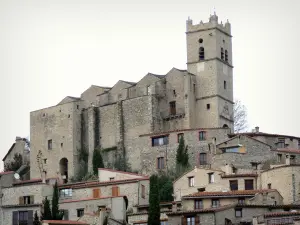 Eus - Bell tower of the Saint-Vincent-d'En-Haut church overlooking the houses of the village
