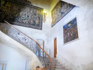 Grignan castle - Inside the chateau: tapestries in the stairway with the wrought iron banister