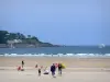 Hendaye - Travelers on the sandy beac, with a view of the Atlantic Ocean and the Spanish coast