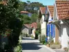 L'Herbe - Small street and flower-bedecked huts of the oyster village, in the town of Lège-Cap-Ferret 