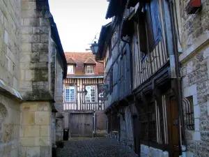 Honfleur - Narrow street of the old town with the Saint-Etienne church hosting the navy museum, and timber-framed houses home to the Ethnography and Popular Art museum