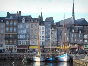 Honfleur - Sailboats in the Vieux Basin pond (port), tall houses of the Sainte-Catherine quay, and Sainte-Catherine church in background