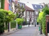 Guía de Isla de Francia - Campagne de París - Alley y casas fachadas del barrio de la Campaña en París subdivisión distrito 20 de París