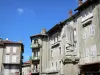 Lalouvesc - Fountain topped by a statue of St. François Régis and facades of the village