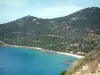 Landscapes of the Corsica coast - The Mediterranean sea, a sandy beach and hills