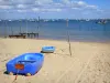 Landscapes of the Gironde - Arcachon bay: small boat on the Piraillan beach in the town of Lège-Cap-Ferret, with sea view 