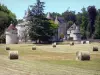 Landscapes of the Gironde - Haystacks in foreground with a view of the castle of La Brède and its park 