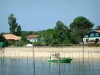 Landscapes of the Gironde - Oyster boat, beach and villas of the Arcachon bay 