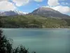 Landscapes of the Hautes-Alpes - Serre-Ponçon lake (water reservoir), mountains and clouds in the blue sky