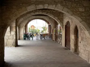 Lauzerte - Medieval Bastide fortified town: under the arcades of the Place des Cornières square