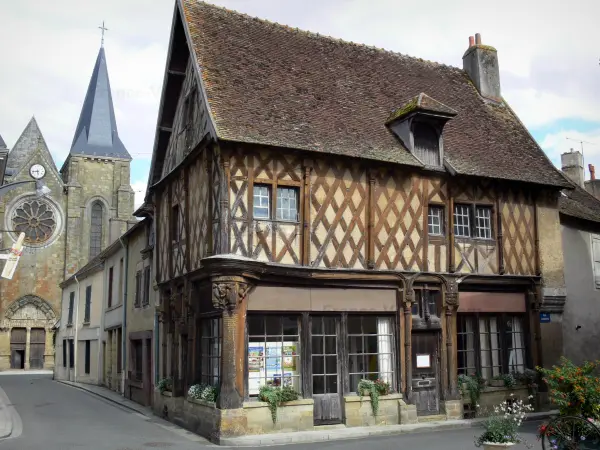 Levroux - Wooden house (Gothic house with wood sides) and collegiate church of Saint-Sylvain in background