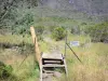 Mafate cirque - Crossing of a fence during a hike