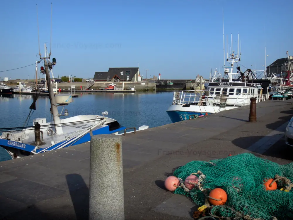Guide of the Manche - Saint-Vaast-la-Hougue - Port: fishing net in foreground, boats moored to the quay, in the Cotentin peninsula