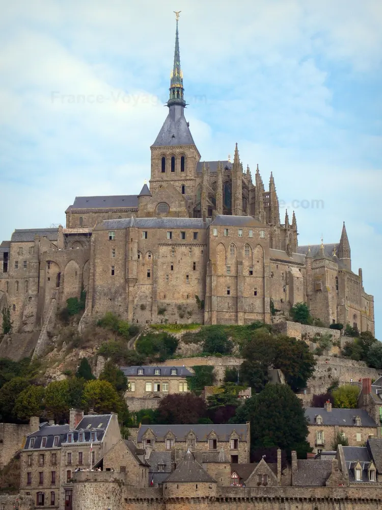 Guide of the Manche - Mont-Saint-Michel - Abbey church and abbatial buildings of the Benedictine abbey dominating the houses and ramparts of the medieval town (village)