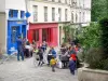 Le Marais - Terrasse de café et devantures colorées de la rue des Barres