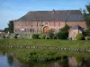 Maroilles - Helpe Mineure river, bank and former brasserie, in the Avesnois Regional Nature Park