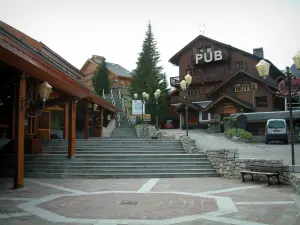 Méribel - Square in the ski resort (winter sports) with stair and wooden residences - chalets