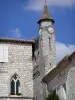 Monflanquin - Medieval bastide town: gemel windows of the home of the Prince Noir (Black Prince) and bell tower of the Saint-André church