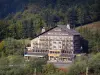 Le Mont-Dore - Ski resort: large cottage surrounded by trees; in the Massif du Sancy mountains (Monts Dore), in the Auvergne Volcanic Regional Nature Park