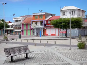 Le Moule - Benches, shops and façades of houses in the town