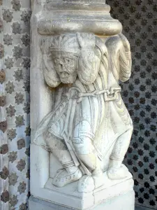 Oloron-Sainte-Marie - Romanesque portal of the Sainte-Marie cathedral: chained Atlanteans of the pierglass