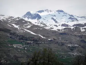 Orcières-Merlette - Orcières 1850: ski resort (winter and summer sports resort), ski area in spring and mountain with snowy summit (snow); in Champsaur