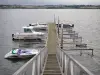 Pareloup lake - Lévézou plateau: boats docked at a pier of the Pareloup lake