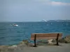 Peninsula of Crozon - Bank with bench, sea (Iroise sea) and boat, coasts far off