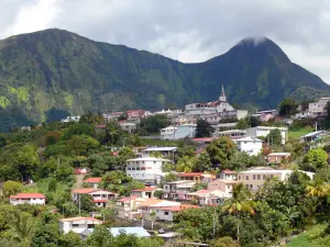 Pitons du Carbet - View of the bell tower and the houses of the village of Morne-Vert at the foot of the Carbet Peaks