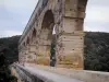 Pont du Gard bridge - Arcades (arches) of the Roman aqueduct (ancient monument); in the town of Vers-Pont-du-Gard