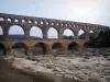 Pont du Gard bridge - Roman aqueduct (ancient monument) with three floors of arcades (arches); in the town of Vers-Pont-du-Gard